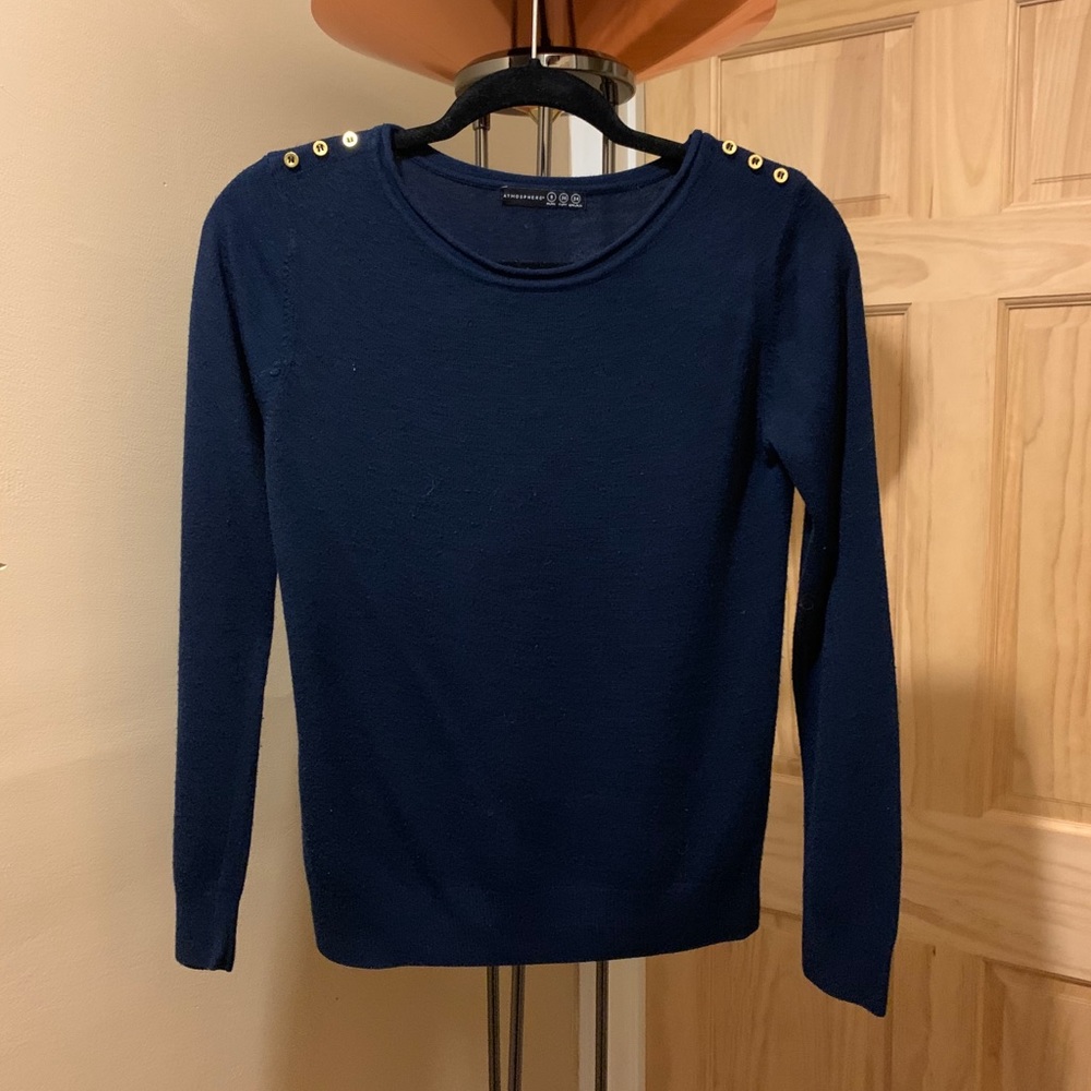 Navy blue sweater with gold button accents